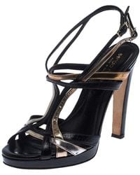 black and gold flat sandals