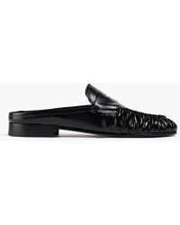 BY FAR Lou Gathered Glossed-leather Slippers - Black