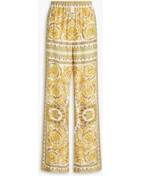 Versace - Hose mit weitem bein aus satin mit print - Lyst