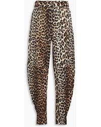 Ganni - Leopard-print Stretch-silk Satin Tapered Pants - Lyst