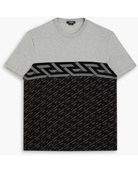 Versace - Meliertes t-shirt aus baumwoll-jersey mit print - Lyst