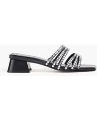 Sandro - Mules aus satin mit kristallverzierung - Lyst