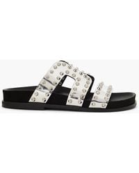 Sandro - Sandalen aus verspiegeltem leder mit stachelnieten - Lyst