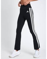 adidas - Women's Optime Essentials 3-stripes Flared leggings - Lyst