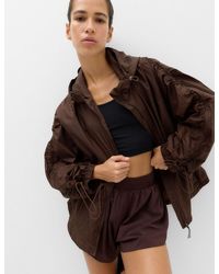 GOODMOVE - Women's Stormwear Shimmer Lightweight Hooded Jacket - Lyst