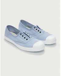 designer white plimsolls