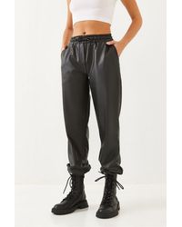 Bianco Lucci - Faux Leather Jogger Pants With Cuffed Legs - Lyst