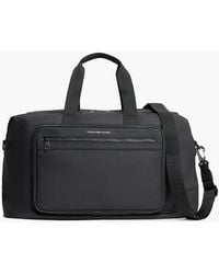 Tommy Hilfiger - Metal Logo Crossbody Duffel Bag - Lyst