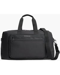 Tommy Hilfiger - Metal Logo Crossbody Duffel Bag - Lyst