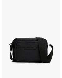Tommy Hilfiger - Crossbody-Reportertasche Mit Logo Aus Metall - Lyst