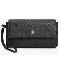 Tommy Hilfiger - Hilfiger Icon Debossed Logo Flap Pouch - Lyst