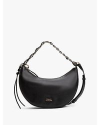 Tommy Hilfiger - Halbmondförmige Crossbody-Tasche Aus Leder - Lyst