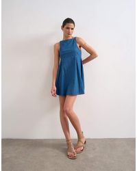 TOPSHOP - Denim Slash Neck Flippy Mini Dress - Lyst