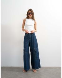 TOPSHOP - Mid Rise Wide Leg Jean With Utility Pocket Detail - Lyst