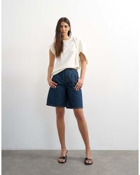 TOPSHOP - Denim Pleated Longline Shorts - Lyst