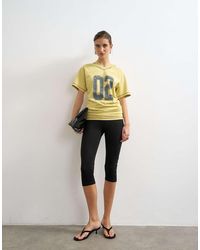 TOPSHOP - Micro V-neck Ruched Sides Graphic Tee - Lyst