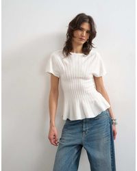 TOPSHOP - Knitted Grown On Short Sleeve Peplum Top - Lyst