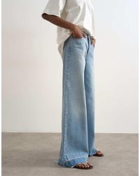 TOPSHOP - Horizon Mid Rise Wide Leg Jean With Let Down Hem Detail - Lyst