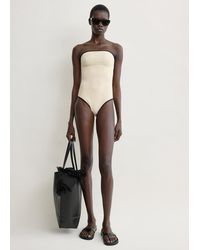 TOTEME - Stripe Edge Strapless Swimsuit - Lyst