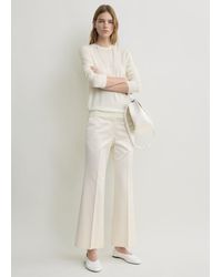 TOTEME - Kick Flare Raw-Edge Trousers - Lyst
