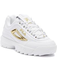 gold and white filas