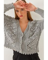 Bianco Lucci - Strickjacke Mit V-Ausschnitt, Pompom Und Drei Knöpfen Für Damen - Lyst