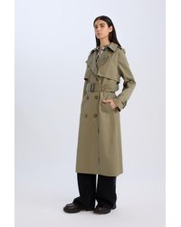 Defacto - Langer Trenchcoat Mit Zweireihigem Ausschnitt – Knopfleiste, Taschen Und Gürtel, Epaulette Für Damen - Lyst