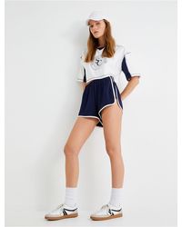 Koton - Asymmetrische Sport-Minishorts Mit Hoher Taille – Bequeme Passform, Gerippt, Gestreift Für Damen - Lyst
