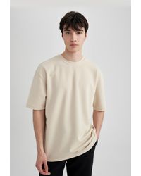 Defacto - Kurzärmliges t-shirt aus schwerem stoff mit rundhalsausschnitt und oversize-passform - xs - Lyst