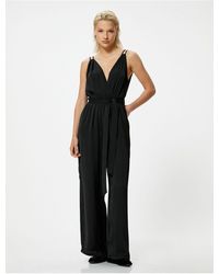 Koton - Jumpsuit mit langem, weitem beinriemen und zweireihigem kragen – mit gürtel - Lyst
