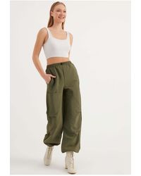 Herita - Fallschirmhose Mit Kordelzug Für Damen - Lyst