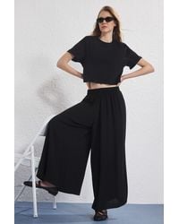 Trendyol - Schwarze Palazzo-Hose Aus Weichem, Bequemem Stoff Mit Elastischem Bund Und Extra Weitem Bein Für Damen - Lyst