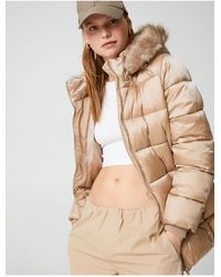 Koton - Pufferjacke Mit Kapuze Aus Kunstfell Und Taschen Für Damen - Lyst