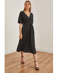 Olalook - Midikleid Mit Gepunkteter Schwarzer Taille Und Zweireihigem Ausschnitt Elb- 19002100 Für Damen - Lyst