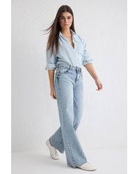 Trendyol - Hellblaue Jeans Mit Normaler Taille Und Weitem Bein Und Ausschnitten Für Damen - Lyst