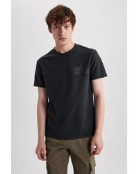 Defacto - Bedrucktes kurzarm-t-shirt aus schwerem stoff mit normaler passform und rundhalsausschnitt a6870ax23au - Lyst