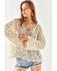 Olalook - E bluse aus baumwollstrick mit spanischen ärmeln und geometrischen details - Lyst
