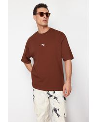 Trendyol - Es, übergroßes/weit geschnittenes, mit dinosauriern besticktes t-shirt aus 100 % baumwolle - xs - Lyst