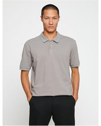 Koton - Basic-t-shirt mit rollkragen, schmaler passform und knöpfen - Lyst