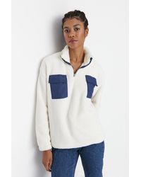 Trendyol - Farbenes, kontrastfarbenes, gestricktes sweatshirt mit stehkragen und taschendetail aus plüsch - Lyst
