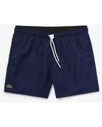 lacoste swim trunks sale