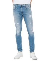 Replay - Anbass 573 bio slim fit jeans bleu clair rip repair - Lyst