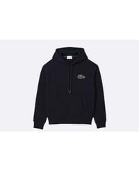 Lacoste - Locker fit mit kapuze mit bio -baumwoll -jogger sweatshirt schwarz - Lyst
