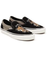 all white slip on vans men