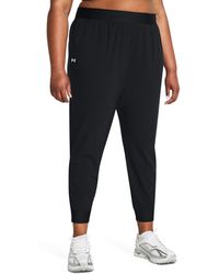 Under Armour - Pantaloni armoursport high-rise woven - Lyst