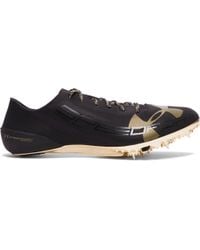 track spikes black and gold