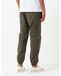 Carhartt Wip Madison Jogger Cuffed Pants in Green for Men | Lyst UK