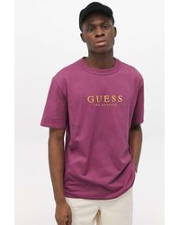 green and purple guess shirt