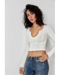 Urban Outfitters - Uo Go For Gold Pointelle Notched Long-sleeved Longline Top - Lyst
