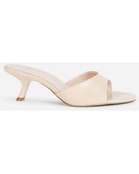 INTENTIONALLY ______ - Given Mule Heel - Lyst